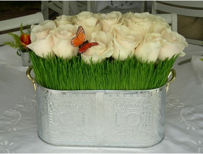 white rose wheatgrass centerpiece metal vase