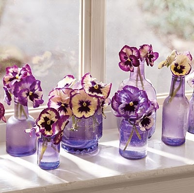 purple pansy centerpieces vintage bottles